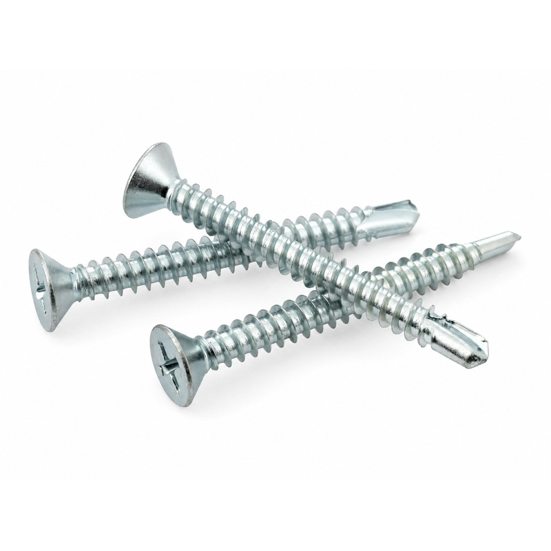 Three silver Phillips-head wood screws lying on a white background, overlapping each other